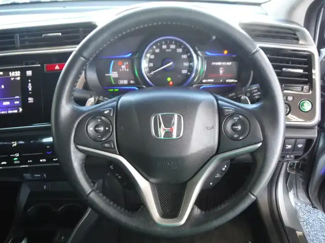 ホンダ グレイス ハイブリッド EX 東京都 2015(平27)年 7.3万km グレー ワンオーナー車/保証書あり/純正ナビ・TV/　BLUETOOTH・HDMI/　バックカメラ・ビルトインETC/ドライブレコーダー/ハーフレザーシート/　前席シートヒーター/あんしんパッケージ/パドルシフト/　クルーズコントロール/モデューロサイドスポイラー/LEDヘッドライト/電動コーナーポール/イルミスカッフプレート/スマートキー×2個