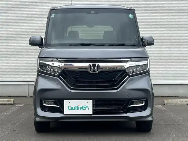 ホンダ Ｎ ＢＯＸ カスタム G L ターボ ホンダセンシング 秋田県 2019(令1)年 8.7万km シャイニンググレーM ４WD/ターボ/安全運転支援システムHondaSENSING/LEDヘッドライト/両側パワースライドドア/純正メモリナビ（DVD/CD再生可能）/フルセグ/バックカメラ/ホンダ純正１５インチアルミ（夏タイヤ装着）/スマートキー/アイドリングストップ/プッシュスタート/アダプティブ・クルーズコントロール追従走行有/コーナーセンサー/レーンキープアシスト/オートマチックハイビーム/ステアリングスイッチ/パドルシフト/前席シートヒーター/ビルトインETC/純正フロアマット/社外ドアバイザー/オートライト/オートエアコン/パワーステアリング/パワーウィンドウ/横滑り防止/盗難防止装置/寒冷地仕様/電動格納ウィンカーミラー