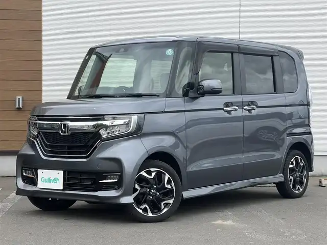 ホンダ Ｎ ＢＯＸ カスタム G L ターボ ホンダセンシング 秋田県 2019(令1)年 8.7万km シャイニンググレーM ４WD/ターボ/安全運転支援システムHondaSENSING/LEDヘッドライト/両側パワースライドドア/純正メモリナビ（DVD/CD再生可能）/フルセグ/バックカメラ/ホンダ純正１５インチアルミ（夏タイヤ装着）/スマートキー/アイドリングストップ/プッシュスタート/アダプティブ・クルーズコントロール追従走行有/コーナーセンサー/レーンキープアシスト/オートマチックハイビーム/ステアリングスイッチ/パドルシフト/前席シートヒーター/ビルトインETC/純正フロアマット/社外ドアバイザー/オートライト/オートエアコン/パワーステアリング/パワーウィンドウ/横滑り防止/盗難防止装置/寒冷地仕様/電動格納ウィンカーミラー