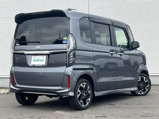 ホンダ Ｎ ＢＯＸ カスタム G L ターボ ホンダセンシング 秋田県 2019(令1)年 8.7万km シャイニンググレーM ４WD/ターボ/安全運転支援システムHondaSENSING/LEDヘッドライト/両側パワースライドドア/純正メモリナビ（DVD/CD再生可能）/フルセグ/バックカメラ/ホンダ純正１５インチアルミ（夏タイヤ装着）/スマートキー/アイドリングストップ/プッシュスタート/アダプティブ・クルーズコントロール追従走行有/コーナーセンサー/レーンキープアシスト/オートマチックハイビーム/ステアリングスイッチ/パドルシフト/前席シートヒーター/ビルトインETC/純正フロアマット/社外ドアバイザー/オートライト/オートエアコン/パワーステアリング/パワーウィンドウ/横滑り防止/盗難防止装置/寒冷地仕様/電動格納ウィンカーミラー