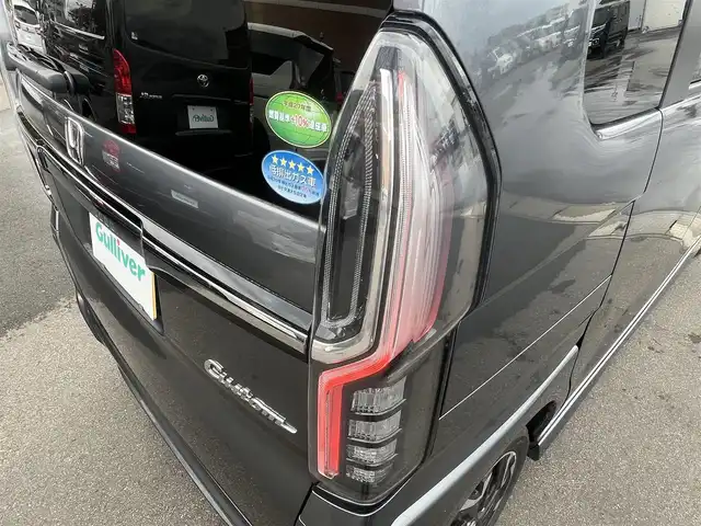 ホンダ Ｎ ＢＯＸ カスタム G L ターボ ホンダセンシング 秋田県 2019(令1)年 8.7万km シャイニンググレーM ４WD/ターボ/安全運転支援システムHondaSENSING/LEDヘッドライト/両側パワースライドドア/純正メモリナビ（DVD/CD再生可能）/フルセグ/バックカメラ/ホンダ純正１５インチアルミ（夏タイヤ装着）/スマートキー/アイドリングストップ/プッシュスタート/アダプティブ・クルーズコントロール追従走行有/コーナーセンサー/レーンキープアシスト/オートマチックハイビーム/ステアリングスイッチ/パドルシフト/前席シートヒーター/ビルトインETC/純正フロアマット/社外ドアバイザー/オートライト/オートエアコン/パワーステアリング/パワーウィンドウ/横滑り防止/盗難防止装置/寒冷地仕様/電動格納ウィンカーミラー
