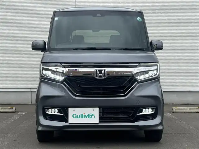 ホンダ Ｎ ＢＯＸ カスタム G L ターボ ホンダセンシング 秋田県 2019(令1)年 8.7万km シャイニンググレーM ４WD/ターボ/安全運転支援システムHondaSENSING/LEDヘッドライト/両側パワースライドドア/純正メモリナビ（DVD/CD再生可能）/フルセグ/バックカメラ/ホンダ純正１５インチアルミ（夏タイヤ装着）/スマートキー/アイドリングストップ/プッシュスタート/アダプティブ・クルーズコントロール追従走行有/コーナーセンサー/レーンキープアシスト/オートマチックハイビーム/ステアリングスイッチ/パドルシフト/前席シートヒーター/ビルトインETC/純正フロアマット/社外ドアバイザー/オートライト/オートエアコン/パワーステアリング/パワーウィンドウ/横滑り防止/盗難防止装置/寒冷地仕様/電動格納ウィンカーミラー