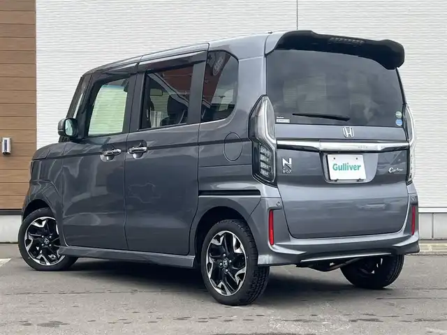 ホンダ Ｎ ＢＯＸ カスタム G L ターボ ホンダセンシング 秋田県 2019(令1)年 8.7万km シャイニンググレーM ４WD/ターボ/安全運転支援システムHondaSENSING/LEDヘッドライト/両側パワースライドドア/純正メモリナビ（DVD/CD再生可能）/フルセグ/バックカメラ/ホンダ純正１５インチアルミ（夏タイヤ装着）/スマートキー/アイドリングストップ/プッシュスタート/アダプティブ・クルーズコントロール追従走行有/コーナーセンサー/レーンキープアシスト/オートマチックハイビーム/ステアリングスイッチ/パドルシフト/前席シートヒーター/ビルトインETC/純正フロアマット/社外ドアバイザー/オートライト/オートエアコン/パワーステアリング/パワーウィンドウ/横滑り防止/盗難防止装置/寒冷地仕様/電動格納ウィンカーミラー