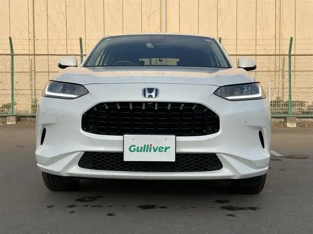 ホンダ ＺＲ－Ｖ ハイブリッド e:HEV Z 東京都 2024(令6)年 1万km プラチナホワイトパール ワンオーナー　/純正９型ナビ　/ＢＯＳＥ　/全周囲カメラ　/電動リアゲート　/レザーシート　/前席パワーシート　/シートヒーター　/ワイヤレス充電　/追従クルコン　/フルセグＴＶ　/前後ドラレコ　/ビルトイン２．０ＥＴＣ/BSＭ/パドルシフト