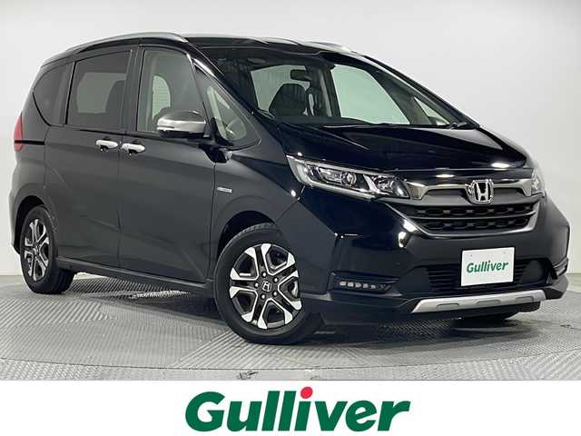 ホンダ フリード ハイブリット クロスター ホンダセンシング 広島県 2021(令3)年 3.6万km クリスタルブラックパール 禁煙車/カロッツェリアナビ/バックカメラ/レーダークルーズコントロール/両側パワースライドドア/ＥＴＣ/レーンキープアシスト/ステアリングスイッチ/衝突被害軽減システム/ＬＥＤヘッドライト/フォグ/オートライト/ＥＣＯＮ/純正15インチアルミホイール(185/65/R15)/エアバッグ(運転席/助手席)