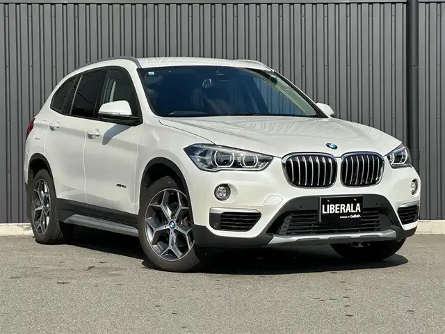 ＢＭＷ Ｘ１ xDrive 18d xライン 福島県 2017(平29)年 4.7万km ミネラルホワイト コンフォート・パッケージ/● オートマチック・テールゲート・オペレーション（オープン／クローズ）/● スライディング・リヤ・シート（リヤ・シート・バックレスト角度調節機能付）/● 電動フロント・シート（運転席&助手席、運転席メモリー機能付）/ハイライン・パッケージ/● パーフォレーテッド・ダコタ・モカレザー・シート/● フロント・シート・ヒーティング/● ファイン・ウッド・オーク・グレイン・マット・インテリア・トリム／パール・クローム・ハイライト/純正HDDナビ/バックカメラ/コーナーセンサー/LEDオートライト/ミラーETC/アンビエントライト/Yスポーク・スタイリング579 18インチアロイ・ホイール/社外17AW冬タイヤ積込