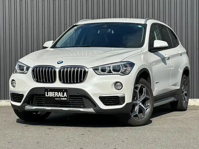 ＢＭＷ Ｘ１ xDrive 18d xライン 福島県 2017(平29)年 4.7万km ミネラルホワイト コンフォート・パッケージ/● オートマチック・テールゲート・オペレーション（オープン／クローズ）/● スライディング・リヤ・シート（リヤ・シート・バックレスト角度調節機能付）/● 電動フロント・シート（運転席&助手席、運転席メモリー機能付）/ハイライン・パッケージ/● パーフォレーテッド・ダコタ・モカレザー・シート/● フロント・シート・ヒーティング/● ファイン・ウッド・オーク・グレイン・マット・インテリア・トリム／パール・クローム・ハイライト/純正HDDナビ/バックカメラ/コーナーセンサー/LEDオートライト/ミラーETC/アンビエントライト/Yスポーク・スタイリング579 18インチアロイ・ホイール/社外17AW冬タイヤ積込