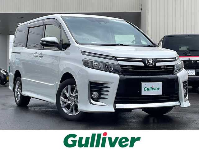 トヨタ ヴォクシー ZS 道北・旭川 2016(平28)年 9.1万km ホワイトパールクリスタルシャイン 寒冷地仕様/社外ナビCD/DVD/SD/TV/バックカメラ/片側パワースライドドア/オートライト/オートハイビーム/アイドリングストップ/衝突軽減ブレーキ/レーンキープアシスト/ETC/横滑り防止/革巻きステアリング/ステアリングリモコン/ドライブレコーダー/フロントワイパーデアイサー/LEDヘッドライト/フォグランプ/スマートキー/純正フロアマット/ドアバイザー/取説・保証書