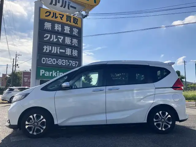 ホンダ フリード＋ クロスター ホンダセンシング 広島県 2022(令4)年 3.8万km プラチナホワイトパール ワンオーナー/ホンダセンシング/純正ナビ（VXM-227VFNi）/両側パワースライドドア/ハーフレザー調シート/フルセグTV/Bluetooth/バックガイドモニター/レーダークルーズ/シートヒーター（運転席・助手席）/ルーフレール/LEDオートライト/新車保証書/取扱説明書/スペアキー