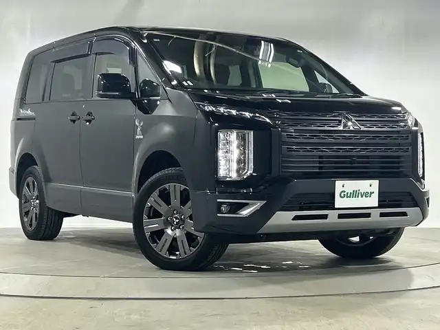 三菱 デリカＤ：５ ジャスパー 神奈川県 2023(令5)年 1.7万km ブラックダイヤモンド/グラファイトグレーメタリック 4WD/純正10.1型SDナビゲーション/AM FM  Bluetooth HDMI CD　DVD/マルチアラウンドモニター/両側パワースライドドア/E-アシスト/レーダークルーズコントロール/シートヒーター/パワーシート/ETC/ドライブレコーダー/フロアマット/ステアリングヒーター/パワーバックドア/スマートキー/スペアキー/LEDヘッドライト/オートライト/オートマチックハイビーム/純正18インチアルミホイル/ドアバイザー/車線維持支持機能/クリアランスソナー