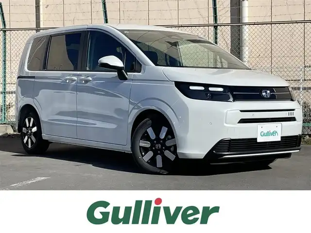 ホンダ フリード ハイブリット e:HEV AIR EX 東京都 2025(令7)年 0.1千km パール 登録済未使用車　/純正9型メモリナビフルセグ/BluetoothAudio/USB/AppleCarPlay/AndroidAuto/両パワ－スライドドア　/リアサーキュレーター/ＬＥＤヘッドライト　/ホンダセンシング　/オートハイビーム　/歩行者事故低減ステアリング　/アダプティブクルーズコントロール　/パーキングセンサ-/ブラインドスポットモニター/衝突軽減ブレーキ/誤発進抑制機能/近距離衝突軽減ブレーキ/路外逸脱抑制機能/プッシュエンジンスタート/保証書＆取説/Wエアバック＆ABS