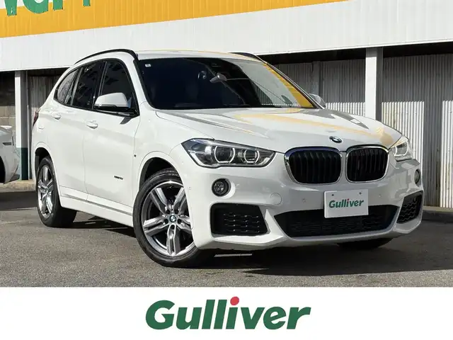 ＢＭＷ Ｘ１ sDrive 18i Mスポーツ 三重県 2018(平30)年 7.7万km アルピンホワイトⅢ ♪車検 令和9年3月29日迄/♪ターボ/インテリジェントセーフティ/パワーバックドア(ハンズフリー機能)/スマートキー×2/プッシュスタート/純正メーカーナビ/・CD・USB・DTV/・DVD再生/・Bluetoothオーディオ/・バックカメラ/コーナーセンサー/前後ドライブレコーダー/前席シートヒーター/アイドリングストップ/ルーフレール/純正18インチAW/LEDヘッドライト/フォグライト/リアフォグライト /オートライト/ウィンカーミラー/電格ミラー/革巻ステアリング/ステアリングスイッチ/スモークフィルム/フロアマット/ETC/サイド/カーテンエアバック