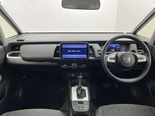 ホンダ フィット e:HEVホーム 群馬県 2020(令2)年 3.5万km ライトブルー ９型ナビ　バックカメラ　ワイヤレス充電器　ハーフレザーシート　衝突被害軽減ブレーキ　レーンアシスト　革巻きステアリング　ＬＥＤ　ＥＴＣ　アダプティブクルーズコントロール　オートマチックハイビーム　禁煙