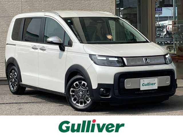 ホンダ フリード クロスター 兵庫県 2025(令7)年 0.1万km未満 プラチナホワイトパール 登録済未使用車/両側パワースライドドア/衝突軽減ブレーキ/レーダークルーズコントロール/コーナーセンサー/ブラインドスポットモニター/ハーフレザーシート/シートヒーター/電動パーキングブレーキ/オートホールド/革巻きステアリング/ステアリングリモコン/スマートキー/スペアキー/電動格納ミラー