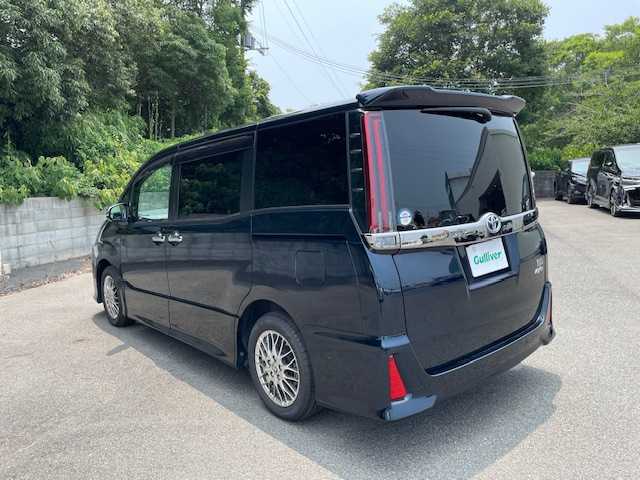 トヨタ ノア ハイブリッド Si ダブルバイビーⅢ 大阪府 2021(令3)年 2.9万km ブラッキッシュアゲハガラスフレーク 純正9型ナビ(NSZT-Y68T)/フルセグ/Bluetooth/トヨタセーフティセンス/ドライブレコーダー前後/シートヒーター前席/ハーフレザーシート/ビルトインETC/両側パワースライドドア/LEDヘッドライト/純正アルミホイール/前後コーナーセンサー/レザー調シートカバー/ステアリングスイッチ/プッシュスタート/スマートキー×２
