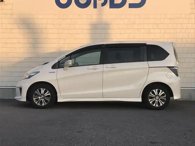 ホンダ フリード ハイブリット 栃木県 2012(平24)年 7万km プレミアムホワイトパール 株)IDOMが運営する【じしゃロン小山店】の自社ローン専用車両になります。こちらは現金またはオートローンご利用時の価格です。自社ローンご希望の方は別途その旨お申付け下さい//禁煙車/純正フルセグナビ/（CD/DVD/AM/FMラジオ）/(Bluetooth)/リモコンキー/ＥＴＣ/片側パワースライドドア/電動格納ドアミラー/パワーウインドウ/防眩ミラー