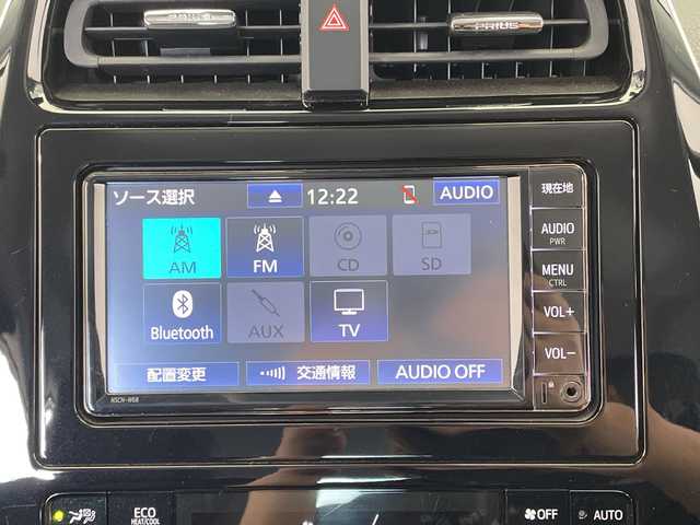 トヨタ プリウス A プレミアム 栃木県 2019(令1)年 2.3万km スティールブロンドM 純正ナビ/（CD/Bluetooth/USB/ワンセグTV）/バックカメラ/社外フルエアロ/トヨタセーフティセンス/クリアランスソナー/ブラインドスポットモニター/リヤクロストラフィックオートアラート/ヘッドアップディスプレイ/ビルトインETC/前後ドライブレコーダー/合皮シート/パワーシート/シートエアコン/シートヒーター/LEDヘッドライト/LEDフォグ/LEDデイライト/スマートキー/プッシュスタート/ステアリングスイッチ/革巻きステアリング/電動格納ミラー/純正アルミホイール/純正フロアマット