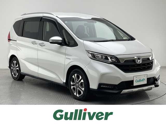 ホンダ フリード ハイブリット クロスター ホンダセンシング 兵庫県 2020(令2)年 4万km プラチナホワイトパール ホンダセンシング/・衝突軽減ブレーキ/・車線逸脱警報/・路外逸脱抑制機能/・誤発進抑制機能/アダプティブクルーズコントロール/純正SDナビ（VXM-204VFi）/・CD/DVD/AM/FM/SD/USB/Bluetooth/フルセグTV/バックカメラ/ビルドインETC/両側パワースライドドア/前席シートヒーター/純正ドライブレコーダー（前のみ）/LEDヘッドライト