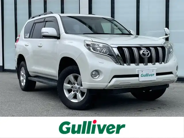 トヨタ ランドクルーザー プラド TX Lパッケージ 大阪府 2014(平26)年 6.9万km ホワイトパールクリスタルシャイン 社外ナビ　/   フルセグＴＶ/CD/DVD/Bluetooth　/バックモニター　/サンルーフ　/前席シートヒーター　/クルーズコントロール　/前席パワーシート/センターデフロック　/前方ドライブレコーダー/純正17インチアルミホイール　/ルーフレール　/プッシュスタート　/スマートキー　/ビルトインＥＴＣ