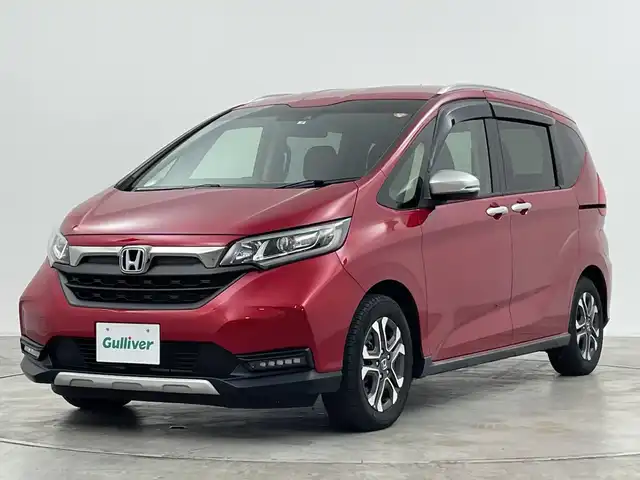 ホンダ フリード ハイブリット クロスター 群馬県 2022(令4)年 3.2万km プレミアムクリスタルレッドM 純正ナビ/Bluetooth/フルセグTV/CD/DVD/ホンダセンシング/シートヒーター/バックカメラ/両側パワースライドドア/前後ドライブレコーダー/ETC/LEDヘッドライト/コーナーセンサー（後方のみ）/純正AW/純正フロアマット/衝突被害軽減システム/レーンキープアシスト/オートライト/ハーフレザーシート/禁煙車