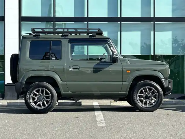 スズキ ジムニー XC 和歌山県 2020(令2)年 0.9万km ジャングルグリーン 衝突軽減ブレーキ/横滑り防止機能/アイドリングストップ/クルコン/シートヒーター/ダウンヒルアシストコントロール/シートカバー/パワーウインドウ/純正AW/ルーフラック/プッシュスタート/スマートキー