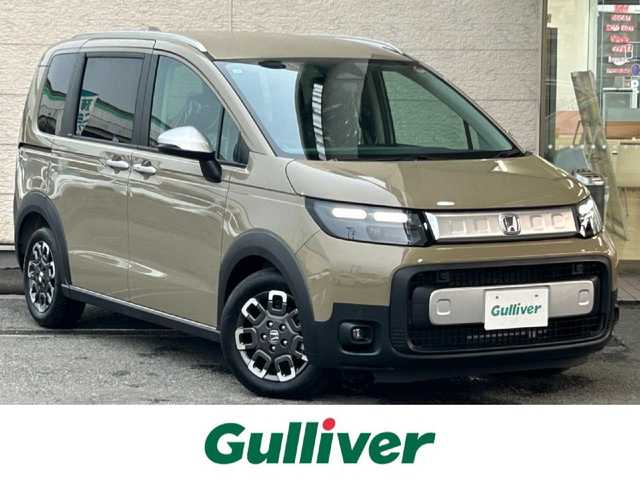 ホンダ フリード クロスター 兵庫県 2025(令7)年 0.1万km未満 ベージュ 登録済未使用車/両側パワースライドドア/衝突軽減ブレーキ/コーナーセンサー/ブラインドスポットモニター/ハーフレザーシート/前席シートヒーター/電動パーキングブレーキ/オートホールド/ステアリングリモコン/革巻きステアリング/スマートキー/スペアキー/純正アルミ15インチ