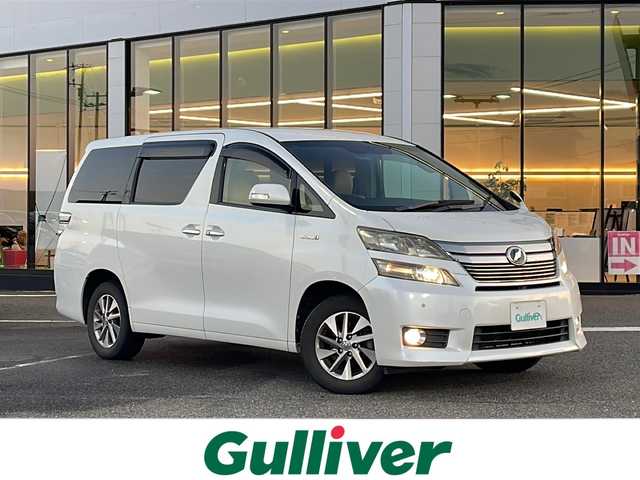 トヨタ ヴェルファイア ハイブリット X 新潟県 2012(平24)年 11万km ホワイトパールクリスタルシャイン コーナーセンサー/キセノンヘッドライト/両側パワスラ　/社外ナビ/BT/CD/USB/ビルトインETC/ipod/フルセグTV/3列シート/オットマン/純正AW/純正フロアマット/カーテンエアバック