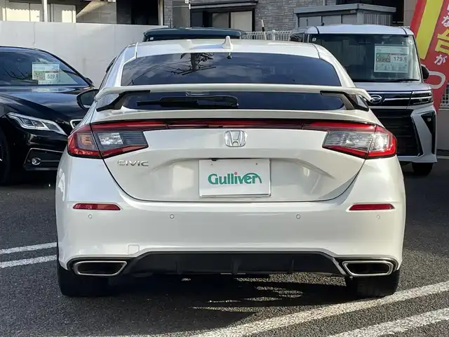 ホンダ シビック EX 大分県 2021(令3)年 2.9万km プラチナホワイトパール ワンオーナー/ハーフレザー調シート/純正OPフロントスポイラー＆リアスポイラー/メーカーOPナビ 【フルセグ/BTオーディオ/USB】/バックカメラ/純正18インチアルミホイール/ビルトインETC2.0/レーダークルーズコントロール/ブラインドスポットモニター/クリアランスソナー/置くだけ充電/電動パーキングブレーキ/前席ヒーター付パワーシート/LEDヘッドライト/LEDフォグランプ/オートライト/レザーステアリング/チルトステアリング/ステアリングリモコン/ウインカーミラー/ミラーヒーター/オートワイパー/横滑り防止装置/アイドリングストップ/エンジンプッシュスタート/リアプライバシーガラス/ドアバイザー/無限フロアマット/電動格納ミラー/カーテン＆サイド＆Wエアバッグ/ABS/スマートキー×2/保証書/車両取説