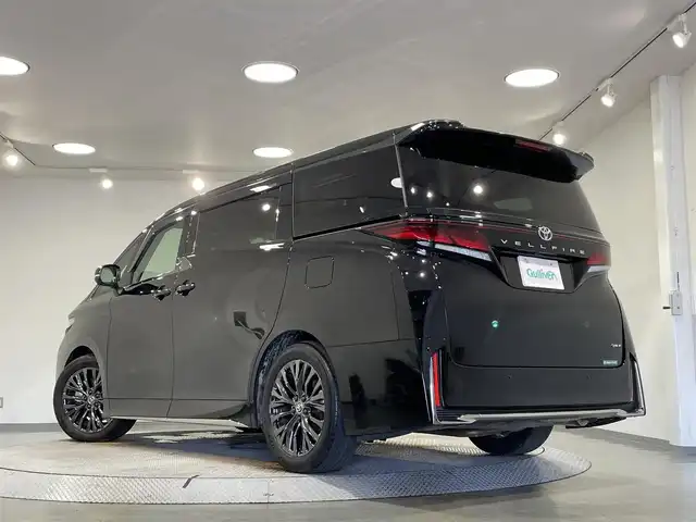 トヨタ ヴェルファイア ハイブリット Z プレミア 愛知県 2023(令5)年 2.1万km ブラック 純正１４インチディスプレイオーディオＰｌｕｓ　/（Bluetooth/フルセグTV/FM/AM/CarPlay/USB)/左右独立ムーンルーフ　/パノラミックビューモニター　/茶革シート　/トヨタチームメイト/　　-アドバンスパーク/アドバンスドライブ/　　-パーキングサポートブレーキ/トヨタセーフティセンス/　　-プリクラッシュセーフティ/　　-レーントレーニングアシスト＋レーンディパーチャーアラート/　　-レーダークルーズコントロール（ACC)/　　-アダプティブハイビームシステム［AHS］/　　-ロードサインアシスト［RSA］/　　-発進遅れ告知機能/両側パワースライドドア/ヘッドアップディスプレイ/ブラインドスポットモニター（BSM)/ビルトインＥＴＣ２．０/ＡＣ１００Ｖ　/置くだけ充電　/シートヒーター/シートベンチレーション/1.2列目パワーシート/ステアリングヒーター/電動バックドア/LEDヘッドライト/LEDフォグランプ/前後ドライブレコーダー/パドルシフト