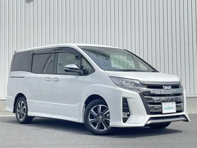 トヨタ ノア Si ダブルバイビーⅢ 群馬県 2021(令3)年 1万km ホワイトパールクリスタルシャイン ワンオーナー　/純正9インチナビ/(AM/FM/BT/TV/DISC/SD)/純正12/1型フリップダウン/両側パワースライドドア/バックカメラ/ETC2.0/トヨタセーフティーセンス/プリクラッシュセーフティー/レーンディパーチャーアラート/パーキングサポートブレーキ/クルーズコントロール/クリアランスソナー/先行車発進お知らせ機能/横滑り防止機能/アイドリングストップ/AUTOライト/AUTOハイビーム/ステアリングリモコン/純正フロアマット/純正ドアバイザー/ウッド調コンビハンドル/取扱説明書/保証書/スペアキー