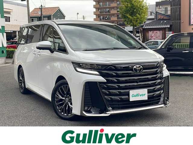 トヨタ ヴェルファイア ハイブリット Z プレミア 愛知県 2025(令7)年 0.5万km プラチナホワイトパールマイカ /ワンオーナー//純正ディスプレイオーディオコネクティッドナビ対応//フルセグTV・Bluetooth・HDMI・miracast//純正フリップダウンモニター//デジタルインナーミラー//両側パワースライドドア//左右独立サンルーフ//レーダークルーズコントロール//パワーシート・メモリーシート//シートヒーター・エアーシート//ステアリングヒーター//置くだけ充電//全方位カメラ//パドルシフト//オートライト・オートハイビーム//コーナーセンサー//ビルトインETC２．０//パワーバックドア//照明付きバニティミラー//純正フロアマット//オートリトラクタブルウインカーミラー//フォグランプ//三眼LEDヘッドライト//トヨタチームメイト//トヨタセーフティセンス//プロアクティブドライビングアシスト//レーンディパーチャーアラート//ドライバーモニター//プリクラッシュセーフティ//フロントクロストラフィックアラート//ドライブスタートコントロール//安心降車アシスト//ロードサインアシスト//先行者発進告知//後送品（保証書・スペアキー）