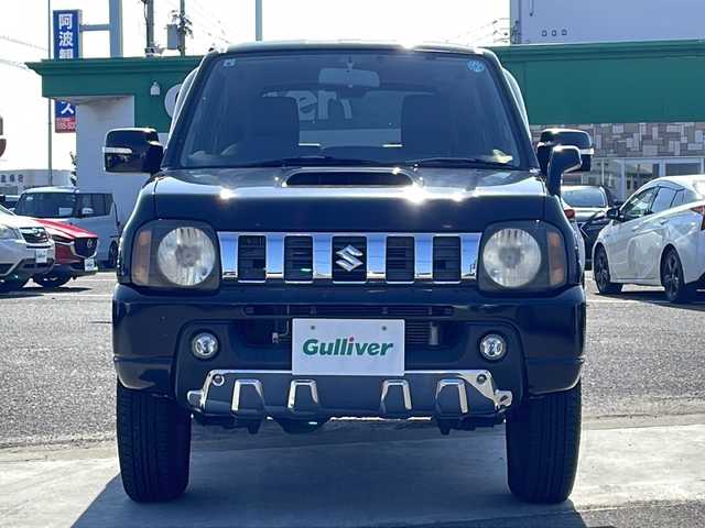 スズキ ジムニー クロスアドベンチャー 徳島県 2013(平25)年 3.7万km ブルーイッシュブラックパール3 7インチナビ【AVIC-MRZ03】/（ワンセグ/AM/FM）/バックカメラ/合皮シート/シートヒーター/背面スペアタイヤ/エアコン/パワーウィンドウ/ハロゲンヘッドライト/ETC/純正AW/ドアバイザー/Wエアバッグ/リモコンキー