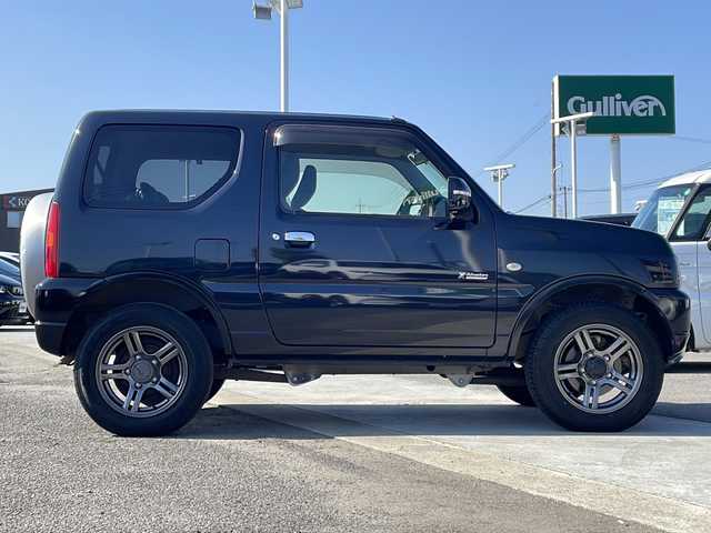 スズキ ジムニー クロスアドベンチャー 徳島県 2013(平25)年 3.7万km ブルーイッシュブラックパール3 7インチナビ【AVIC-MRZ03】/（ワンセグ/AM/FM）/バックカメラ/合皮シート/シートヒーター/背面スペアタイヤ/エアコン/パワーウィンドウ/ハロゲンヘッドライト/ETC/純正AW/ドアバイザー/Wエアバッグ/リモコンキー