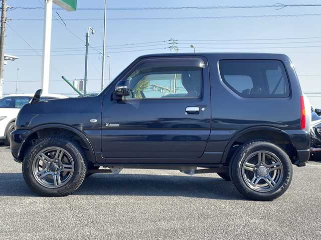 スズキ ジムニー クロスアドベンチャー 徳島県 2013(平25)年 3.7万km ブルーイッシュブラックパール3 7インチナビ【AVIC-MRZ03】/（ワンセグ/AM/FM）/バックカメラ/合皮シート/シートヒーター/背面スペアタイヤ/エアコン/パワーウィンドウ/ハロゲンヘッドライト/ETC/純正AW/ドアバイザー/Wエアバッグ/リモコンキー