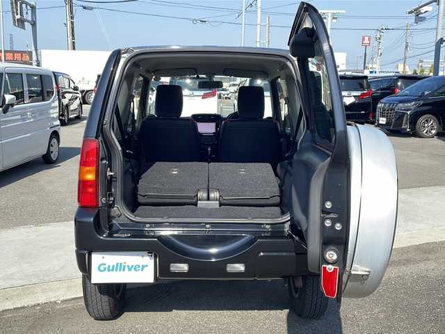 スズキ ジムニー クロスアドベンチャー 徳島県 2013(平25)年 3.7万km ブルーイッシュブラックパール3 7インチナビ【AVIC-MRZ03】/（ワンセグ/AM/FM）/バックカメラ/合皮シート/シートヒーター/背面スペアタイヤ/エアコン/パワーウィンドウ/ハロゲンヘッドライト/ETC/純正AW/ドアバイザー/Wエアバッグ/リモコンキー