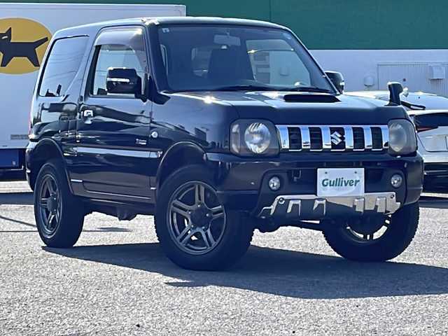 スズキ ジムニー クロスアドベンチャー 徳島県 2013(平25)年 3.7万km ブルーイッシュブラックパール3 7インチナビ【AVIC-MRZ03】/（ワンセグ/AM/FM）/バックカメラ/合皮シート/シートヒーター/背面スペアタイヤ/エアコン/パワーウィンドウ/ハロゲンヘッドライト/ETC/純正AW/ドアバイザー/Wエアバッグ/リモコンキー