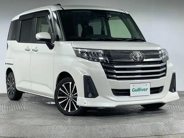 トヨタ ルーミー カスタムG－T 神奈川県 2021(令3)年 1.7万km パールホワイトⅢ ・純正９型SDナビゲーション【NSZT-Y68T】/＜フルセグ/AMFM/BT/CD/DVD/SDREC＞/・パノラミックビューモニター/・両側パワースライドドア/・社外前後ドライブレコーダー/・純正ビルトインETC2.0/・電動パーキングブレーキ/ブレーキホールド/・アイドリングストップ/・前席シートヒーター/・スマートキー/・プッシュスタート/・スペアキー/・2列目シートバックテーブル/・前後ソナー/・オートライト/オートハイビーム /・LEDヘッドライト/フォグ/・純正１５インチアルミホイール/・パノラミックビュー対応ナビレディパッケージ/・コンフォートパッケージ