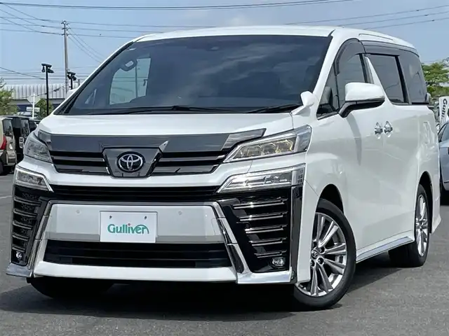 トヨタ ヴェルファイア Z ゴールデンアイズ 道央・札幌 2020(令2)年 4.3万km ホワイトパールクリスタルシャイン ４WD/純正ディーラーOPナビ/CD/DVD/BT/フルセグ/プリクラッシュセーフティ/横滑り防止装置/レーダークルーズコントロール/レーンキープアシスト/クリアランスソナー/パーキングサポートブレーキ/ロードサインアシスト/バックカメラ/ビルトインETC2.0/アイドリングストップ/ECOMODE/nanoe/両側パワースライドドア/パワーバックドア/2列目オットマン/ハーフレザーシート/革巻きウッドコンビステアリング/ステアリングリモコン/AC100V/電動パーキング/ブレーキホールド/MTモード付AT/プッシュスタート/スマートキー/LEDヘッドライト/オートライト/オートハイビーム/フォグランプ/電動格納ミラー/ウィンカーミラー/フロアマット/ドアバイザー/スペアキー