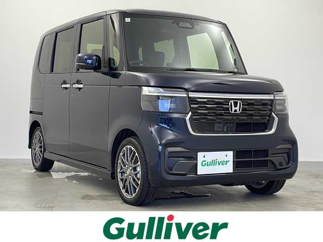 ホンダ Ｎ ＢＯＸ カスタム ターボ 大阪府 2024(令6)年 0.5万km ミッドナイトブルービームM 禁煙車/純正9型ナビ/（BT/CD/DVD/AppleCarPlay/AndroidAuto/フルセグ）/両側電動スライドドア/前方ドライブレコーダー/バックカメラ/ETC/ホンダセンシング/・衝突軽減ブレーキ（CMBS）/・誤発進抑制機能（前方・後方）/・歩行者事故低減ステアリング/・路外逸脱抑制機能/・アダプティブクルーズコントロール（ACC）/・車線維持支援システム（LKAS）/・先行車発進お知らせ機能/・標識認識機能/・オートハイビーム/パドルシフト/ハーフレザー/電動パーキング/オートホールド/オートエアコン/USB（Type-A/Type-C）/スマートキー/スペアキー/オートライト/LEDヘッドライト