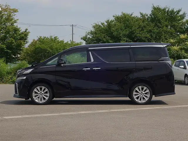 トヨタ ヴェルファイア Z 山形県 2015(平27)年 5.2万km バーニングブラッククリスタルシャインガラスフレーク 4WD/メモリナビ/　　【CD DVD BT フルセグ USB】/バックカメラ/パワースライドドア/LEDオートヘッドライト/オットマン/純正18インチアルミホイール/アイドリングストップ/コーナーセンサー/ステアリングスイッチ/MTモード付AT/電動格納ウィンカーミラー/フォグランプ/フロアマット/ドアバイザ―/スマートキー/ETC