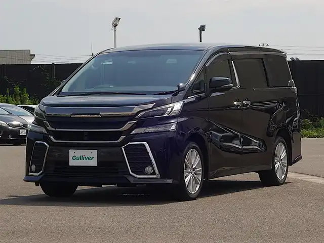 トヨタ ヴェルファイア Z 山形県 2015(平27)年 5.2万km バーニングブラッククリスタルシャインガラスフレーク 4WD/メモリナビ/　　【CD DVD BT フルセグ USB】/バックカメラ/パワースライドドア/LEDオートヘッドライト/オットマン/純正18インチアルミホイール/アイドリングストップ/コーナーセンサー/ステアリングスイッチ/MTモード付AT/電動格納ウィンカーミラー/フォグランプ/フロアマット/ドアバイザ―/スマートキー/ETC
