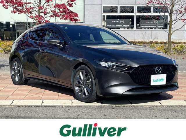 マツダ マツダ３ファストバック 15S ツーリング 福島県 2021(令3)年 3.5万km マシーングレープレミアムM i-ACTIVESENSE/ヘッドアップディスプレイ/純正SDナビ/（BT/USB/HDMI/フルセグTV/AM/FM）/バックカメラ/ブラインドスポットモニター/レーンキープアシスト/前後コーナーセンサー/オートホールド/LEDヘッドライト/オートハイビーム/オートワイパー/ETC/ドライブレコーダー前後/純正18インチAW/プッシュスタート/スマートキー