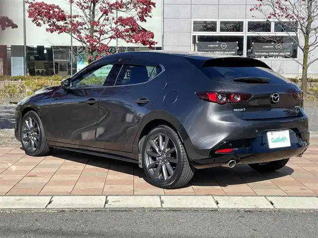 マツダ マツダ３ファストバック 15S ツーリング 福島県 2021(令3)年 3.5万km マシーングレープレミアムM i-ACTIVESENSE/ヘッドアップディスプレイ/純正SDナビ/（BT/USB/HDMI/フルセグTV/AM/FM）/バックカメラ/ブラインドスポットモニター/レーンキープアシスト/前後コーナーセンサー/オートホールド/LEDヘッドライト/オートハイビーム/オートワイパー/ETC/ドライブレコーダー前後/純正18インチAW/プッシュスタート/スマートキー