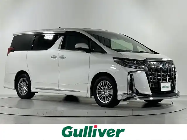 トヨタ アルファードハイブリット SR Cパッケージ 佐賀県 2023(令5)年 1.4万km ホワイトパールクリスタルシャイン メーカーオプション10.5インチナビ/（フルセグTV.CD.DVD.Bluetooth）/モデリスタエアロ/サンルーフ/JBLプレミアムサウンド/3眼LEDヘッドライト/衝突被害軽減システム/全方位バックカメラ/ブラインドスポットモニター/レーダークルーズコントロール/パーキングサポートブレーキ/ロードサインアシスト/レーンキープアシスト/アドバンスドパーク（高度駐車支援システム）/オートマチックハイビーム/オートライト/デジタルインナールームミラー/前後ドライプレコーダー/両側パワースライドドア/ステアリングヒーター/ビルトインET2.0/運転席・助手席パワーシート/運転席・助手席シートヒーター/運転席・助手席エアシート/メモリーシート/合皮シート/後席サンシェード
