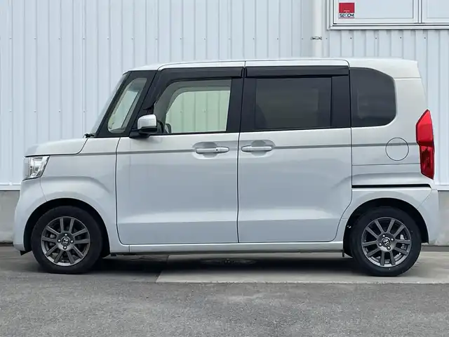 ホンダ Ｎ ＢＯＸ EX ターボ 愛媛県 2023(令5)年 1.8万km プレミアムサンライトホワイトパール ホンダセンシング/衝突被害軽減ブレーキ/レーンキープアシスト/前後誤発進抑制機能/アダプティブクルーズコントロール/ロードサインアシスト/クリアランスソナー/純正7インチナビ【VXM-235Ci】/　CD/Bluetooth/バックカメラ/前後ドライブレコーダー/ビルトインETC/プッシュスタート/前席シートヒーター/純正14インチAW/オートライト/LEDヘッドライト/バックテーブル/パドルシフト/ドアバイザー/フロアマット