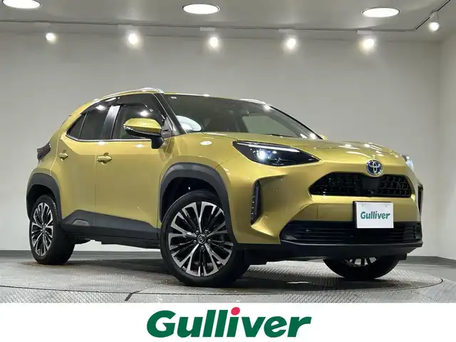 トヨタ ヤリスクロス ハイブリッド Z 愛知県 2021(令3)年 3万km ブラスゴールドメタリック 純正８インチディスプレイオーディオ　/パノラミックビューモニター/レーダークルーズコントロール/プリクラッシュセーフティ/ブラインドスポットモニター/レーントレーシングアシスト/クリアランスソナー/先行車発進告知/パワーバックドア/シートヒーター/ハーフレザーシート/前後ドライブレコーダー/ビルトインＥＴＣ/USB入力端子/アクセサリーソケット/TVキャンセラー/純正18インチアルミホイール/純正フロアマット