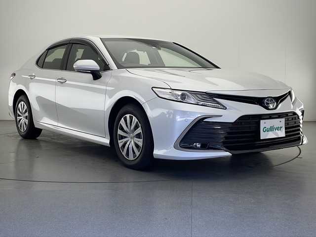 トヨタ カムリ X 宮崎県 2022(令4)年 2.4万km プラチナホワイトパールマイカ 禁煙車/トヨタセーフティセンス/純正9型ディスプレイオーディオナビTV/（T-connect/Bluetooth/FMAM/フルセグTV)/純正バックカメラ/純正ビルトインETC/純正LEDオートライト/純正LEDフォグ/純正フロアマット/社外前後ドライブレコーダー/アダプティブクルーズコントロール/プリクラッシュセーフティ/レーンディパーチャーアラート/オートマチックハイビーム/クリアランスソナー/電子パーキング/オートホールド/デュアルオートエアコン（ナノイー）/スマートキー/プッシュエンジンスタート/スペアキー/新車時保証書/取扱い説明書