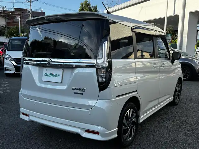 スズキ ソリオ バンディット HV MV 熊本県 2023(令5)年 2.4万km ピュアホワイトP 純正9インチナビ（3A103-59S06）/【フルセグTV/CD/DVD】/全方位カメラ/バックカメラ/両側パワースライドドア/レーダークルーズコントロール/衝突被害軽減ブレーキ/レーンキープアシスト/ヘッドアップディスプレイ/アイドリングストップ/シートヒーター/純正15インチAW/前後ドライブレコーダー/ビルトインETC/オートLEDヘッドライト/ウィンカーミラー/プッシュスタート/ステアリングスイッチ/純正フロアマット/純正ドアバイザー/横滑り防止/盗難防止装置/保証書/取扱説明書