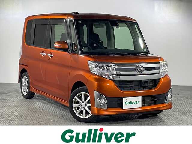 ダイハツ タント カスタム X SAⅡ 沖縄県 2015(平27)年 5.4万km トニコオレンジメタリック 禁煙車/社外ディスプレイオーディオ[FH9200DVD]/ＣＤ　ＤＶＤ　Ｂｌｕｅｔｏｏｔｈ/片側パワースライド/純正アルミ/コーナーセンサー/前方ドライブレコーダー/ＥＴＣ/スマートキー/プッシュスタート/横滑り防止機能/取扱説明書/保証書