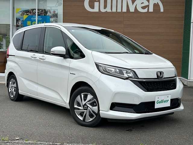 ホンダ フリード ハイブリット G ホンダセンシング 静岡県 2020(令2)年 4.5万km プラチナホワイトパール 純正ナビ/バックカメラ/CD/DVD/Bluetooth/ワンセグTV/衝突被害軽減システム/コーナーセンサー/両側パワースライドドア/クルーズコントロール/LEDオートライト/ドライブレコーダー/ETC/純正フロアマット/スマートキー/スペアキー1本/盗難防止装置/レーンキープアシスト/アイドリングストップ/プッシュスタート/オートエアコン